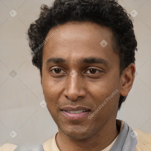 Joyful latino young-adult male with short  brown hair and brown eyes