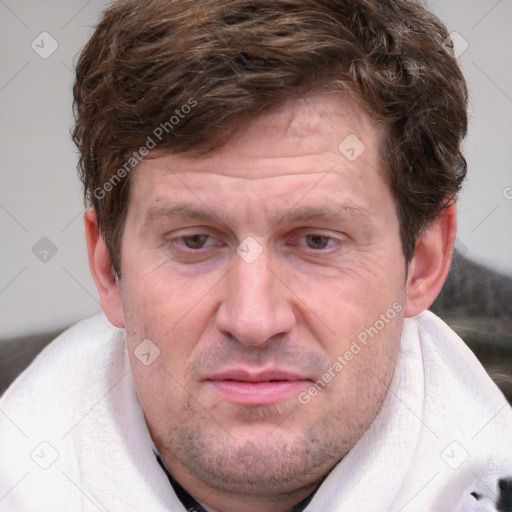 Joyful white adult male with short  brown hair and grey eyes