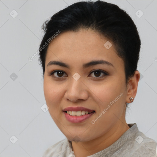 Joyful latino young-adult female with short  brown hair and brown eyes