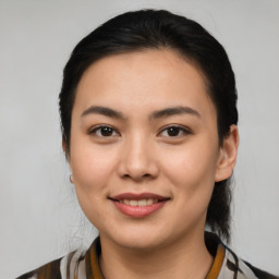 Joyful latino young-adult female with medium  brown hair and brown eyes