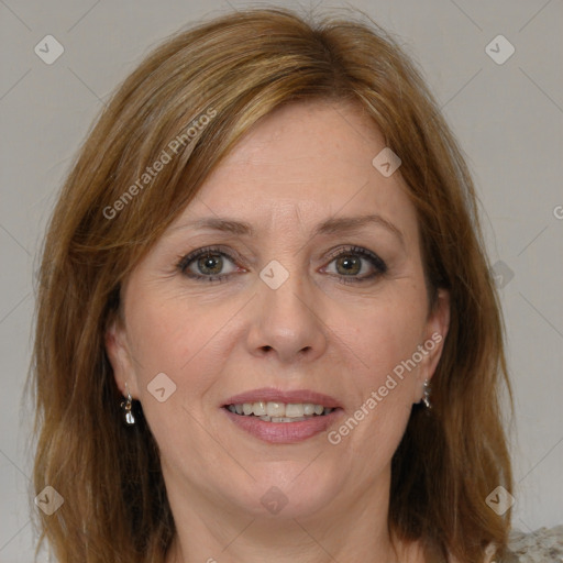 Joyful white adult female with medium  brown hair and brown eyes