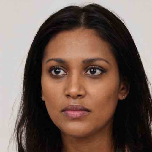 Neutral black young-adult female with long  black hair and brown eyes