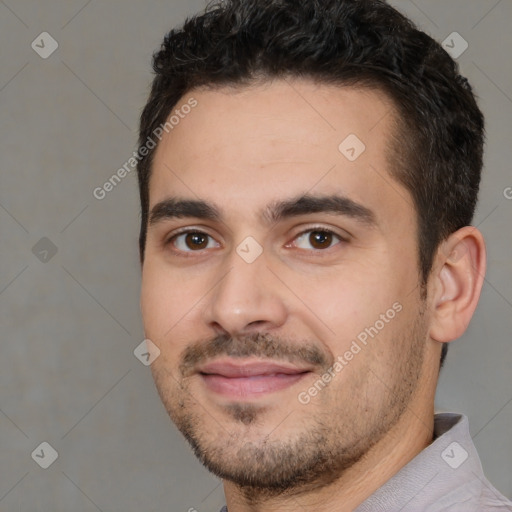 Joyful white young-adult male with short  black hair and brown eyes