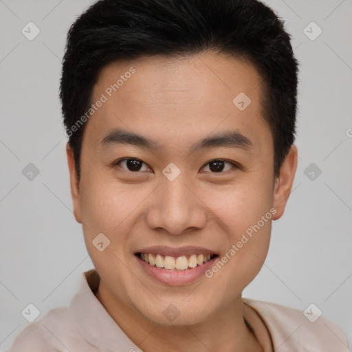 Joyful asian young-adult male with short  brown hair and brown eyes