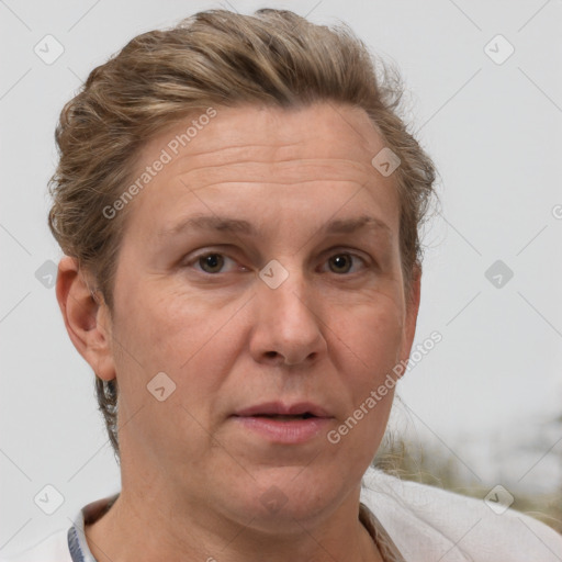 Joyful white adult female with short  brown hair and grey eyes