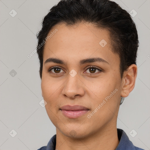 Joyful latino young-adult female with short  brown hair and brown eyes