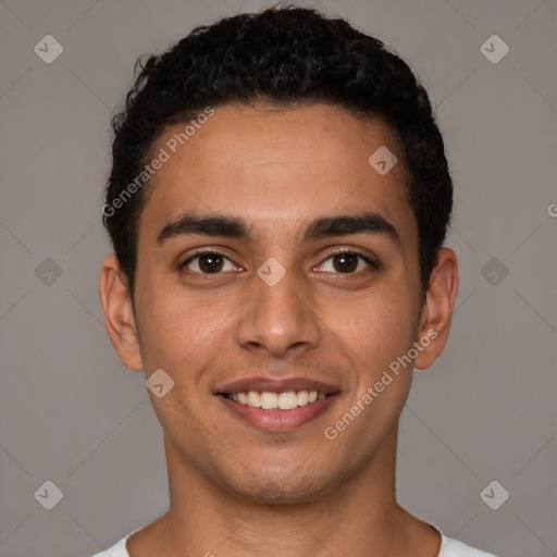 Joyful white young-adult male with short  black hair and brown eyes