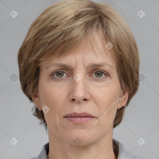 Joyful white adult female with medium  brown hair and grey eyes