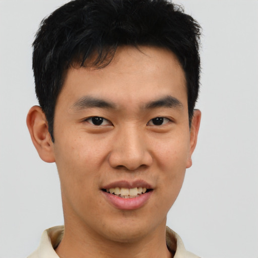 Joyful asian young-adult male with short  brown hair and brown eyes