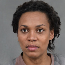 Neutral black adult female with short  brown hair and brown eyes