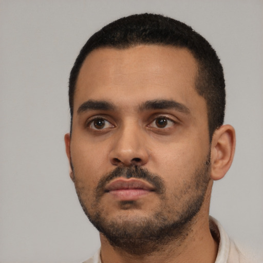 Neutral latino young-adult male with short  black hair and brown eyes