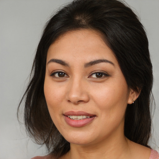 Joyful asian young-adult female with medium  brown hair and brown eyes