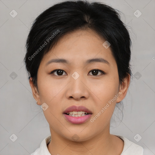 Joyful asian young-adult female with short  black hair and brown eyes