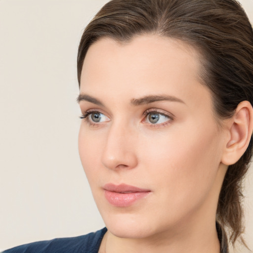 Neutral white young-adult female with medium  brown hair and grey eyes