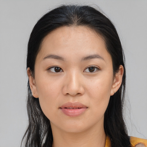 Joyful asian young-adult female with long  black hair and brown eyes