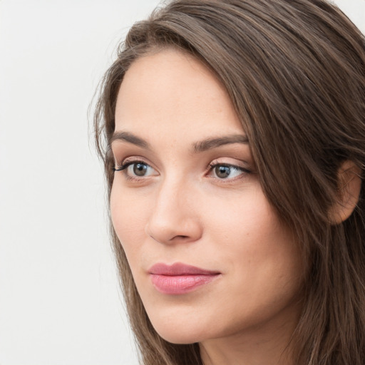 Neutral white young-adult female with long  brown hair and grey eyes