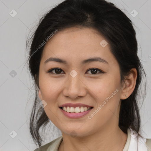 Joyful asian young-adult female with medium  brown hair and brown eyes