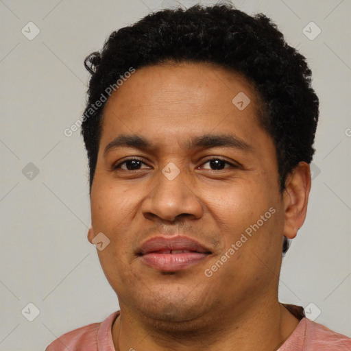 Joyful latino young-adult male with short  brown hair and brown eyes