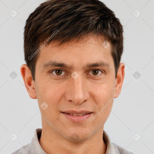 Joyful white young-adult male with short  brown hair and brown eyes