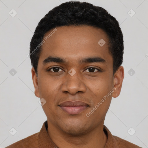 Joyful black young-adult male with short  black hair and brown eyes