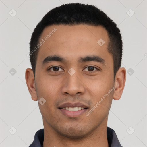 Joyful latino young-adult male with short  black hair and brown eyes