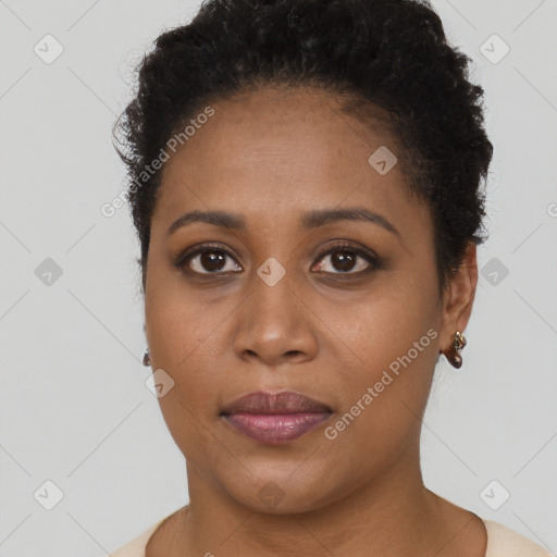 Joyful black young-adult female with short  brown hair and brown eyes