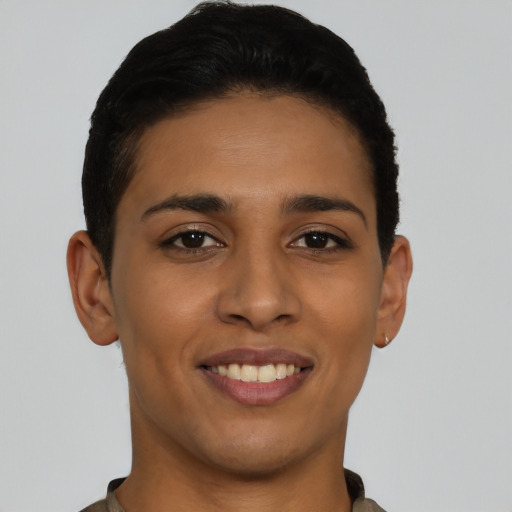 Joyful latino young-adult female with short  brown hair and brown eyes
