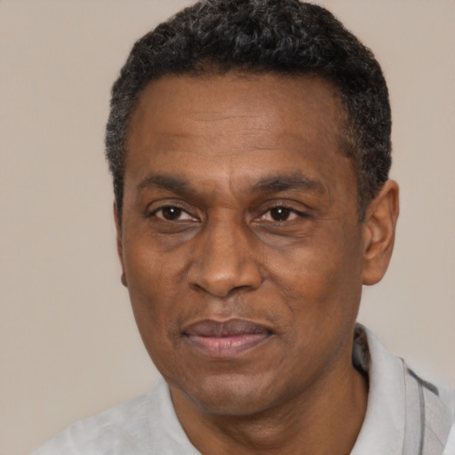 Joyful latino adult male with short  black hair and brown eyes