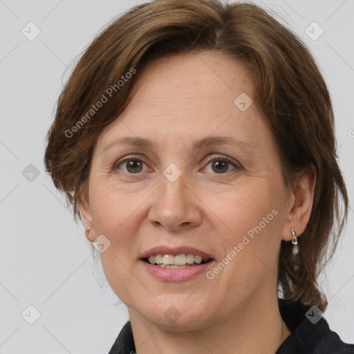 Joyful white adult female with medium  brown hair and grey eyes