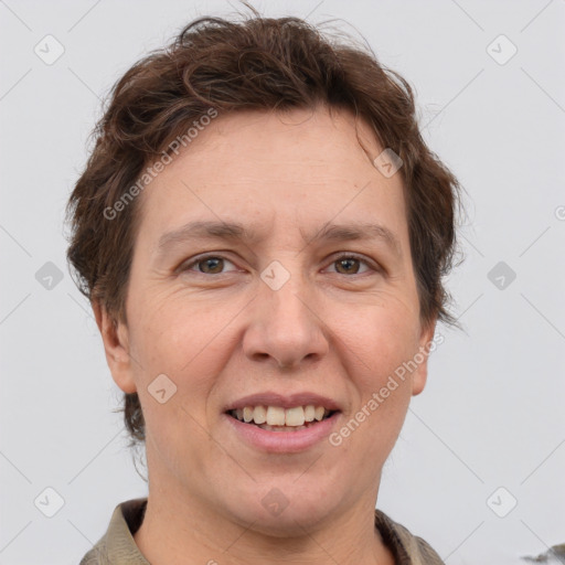 Joyful white adult female with short  brown hair and grey eyes