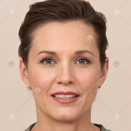 Joyful white adult female with short  brown hair and grey eyes