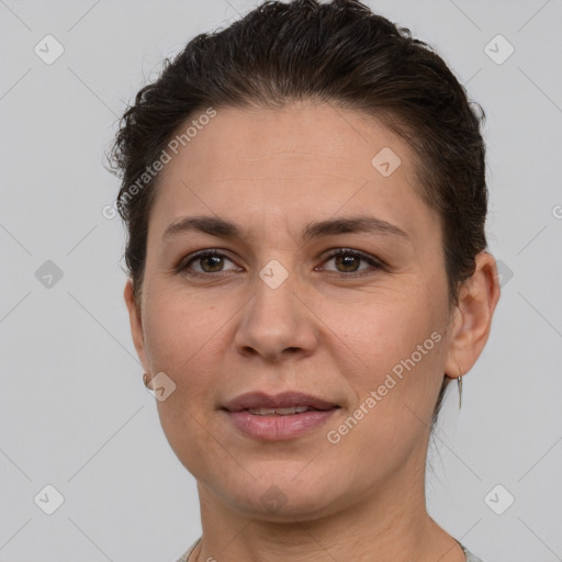 Joyful white adult female with short  brown hair and brown eyes