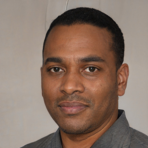 Neutral black young-adult male with short  black hair and brown eyes