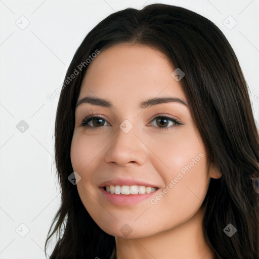 Joyful white young-adult female with long  black hair and brown eyes