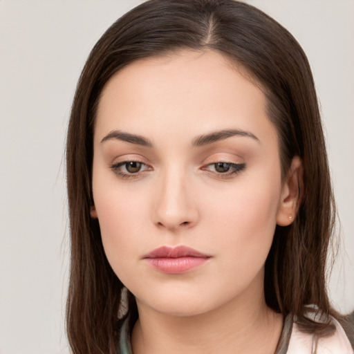 Neutral white young-adult female with long  brown hair and brown eyes