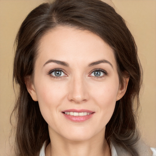 Joyful white young-adult female with medium  brown hair and grey eyes