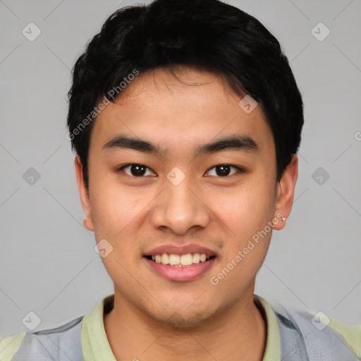 Joyful asian young-adult male with short  black hair and brown eyes