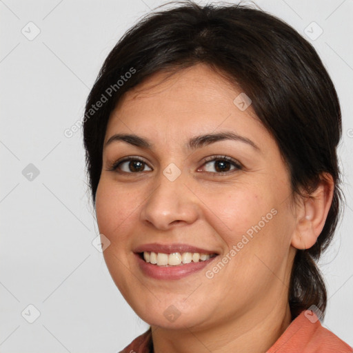 Joyful white young-adult female with medium  brown hair and brown eyes