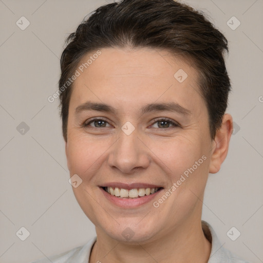 Joyful white young-adult female with short  brown hair and brown eyes