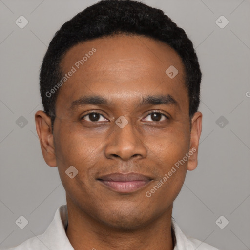 Joyful black young-adult male with short  black hair and brown eyes