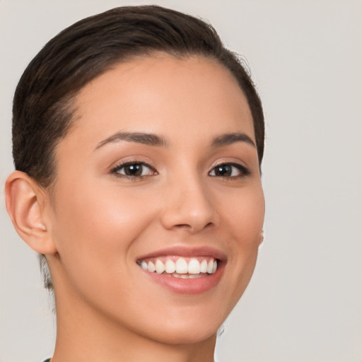 Joyful white young-adult female with short  brown hair and brown eyes