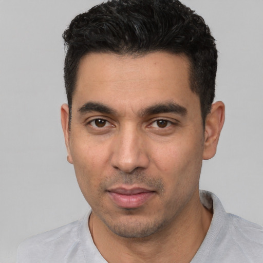 Neutral white young-adult male with short  black hair and brown eyes