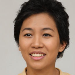 Joyful asian young-adult female with medium  brown hair and brown eyes