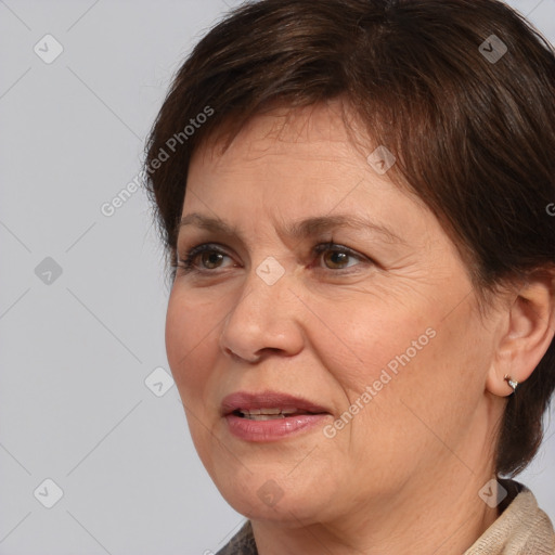 Joyful white adult female with medium  brown hair and brown eyes