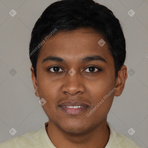 Joyful black young-adult male with short  black hair and brown eyes