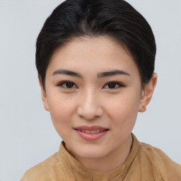 Joyful asian young-adult female with short  brown hair and brown eyes