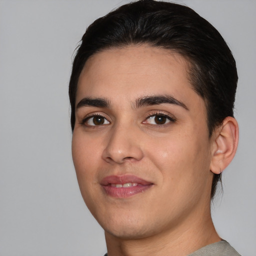 Joyful white young-adult male with medium  black hair and brown eyes
