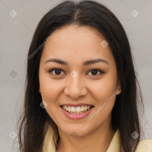 Joyful latino young-adult female with long  brown hair and brown eyes