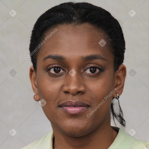 Joyful black young-adult female with short  black hair and brown eyes