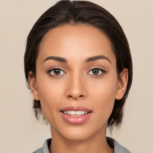 Joyful white young-adult female with medium  brown hair and brown eyes